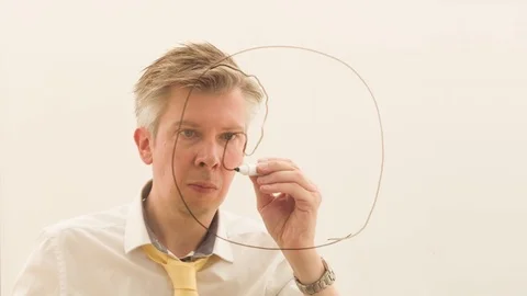 Brainstorming drawing an image of the world onto glass  Stock Footage 80719866