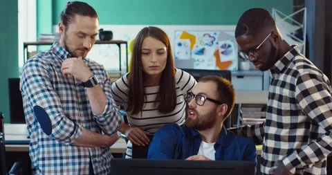 Brainstorming multinational team. Work of managers on project in coworking Stock Footage 141365052