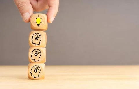 Brainstorming process and idea concept. Wooden blocks with gear head icon ... Stock Photos