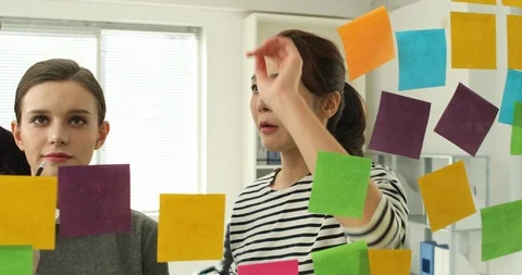 Brainstorming start-up Glass with post-it notes, free meeting Stock Footage 100957540