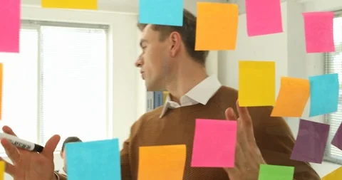 Brainstorming start-up Glass with post-it notes, free meeting Stock Footage 100957822