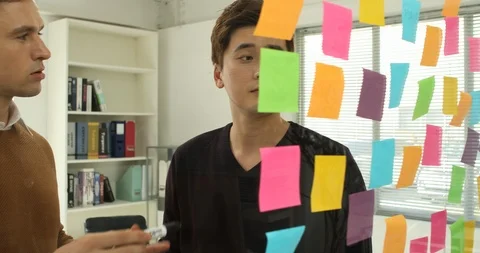 Brainstorming start-up Glass with post-it notes, free meeting Stock Footage 100957883