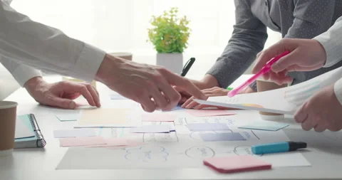 Brainstorming team of business people using sticky notes on the desktop. 4K. Stock Footage 155341399