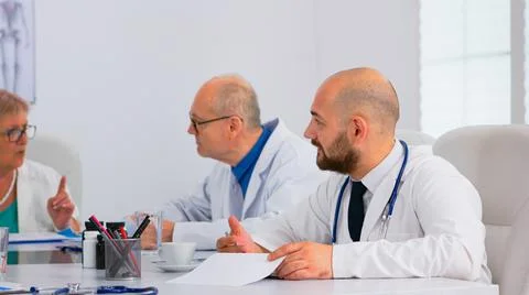 Brainstorming teamwork of physicians solving problems of patients Stock Photos