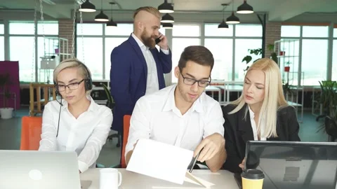 Brainstorming time of people in the light office Stock Footage 145486427