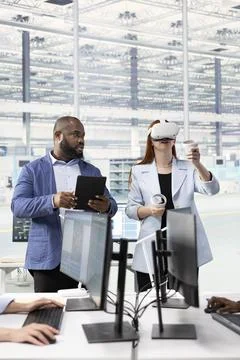Brainstorming, VR and multiracial team testing microchip electronics Stock Photos
