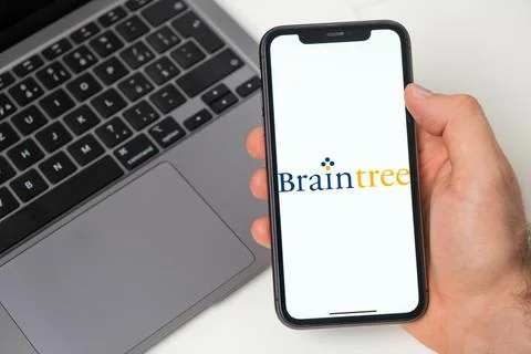 Braintree crypto wallet logo on the screen of mobile phone and notebook on the Stock Photos