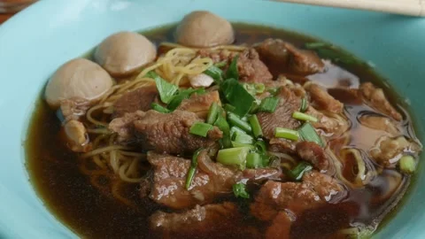 Braised beef noodle soup set on table. Stock Footage 306594411