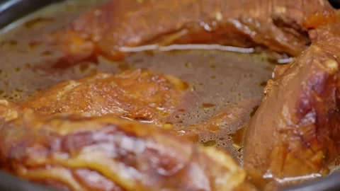 Braised beef soaked in rich sauce. Stock Footage 345459937