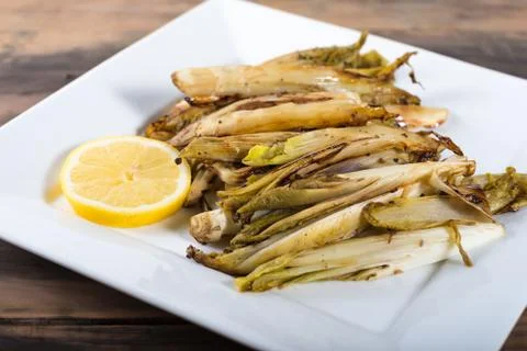 Braised belgian endive side dish Stock Photos