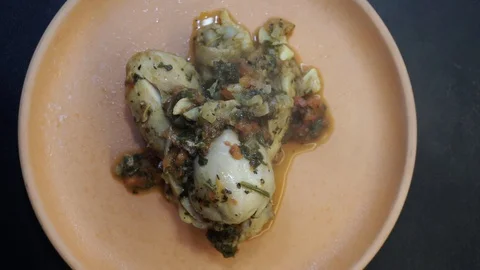 Braised chicken on the plate overhead Stock Footage 121118656