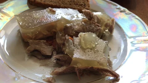 Braised jelly with black bread on a beautiful plate. Video stock 103736986