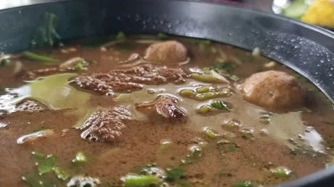 Braised meat noodles in a ceramic cup, Place on the table ready to serve. Stock Footage 220168591