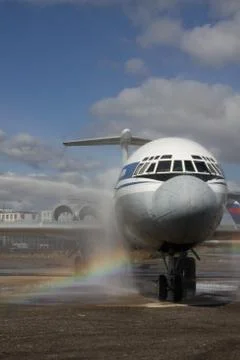 Braised plane on background of the rainbow Stock Photos