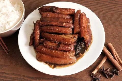 Braised Pork Belly with Pickled Cabbage and Steamed Rice on Wooden Table Stock Photos