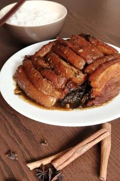 Braised Pork Belly with Pickled Cabbage and Steamed Rice on Wooden Table Stock Photos
