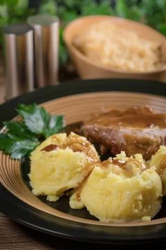 Braised pork neck in own sauce. Shallow depth of field. Stock Photos