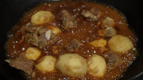 Braised pork ribs with taros or Chinese eddo?es. Stock Footage 345315765