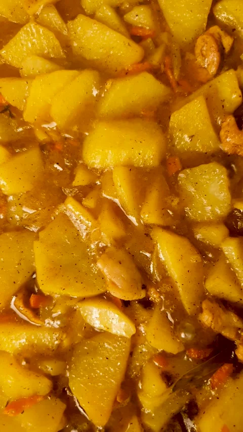 Braised Potatoes in Meat Broth Vertical Video. How to cook potatoes Stock Footage 345743048