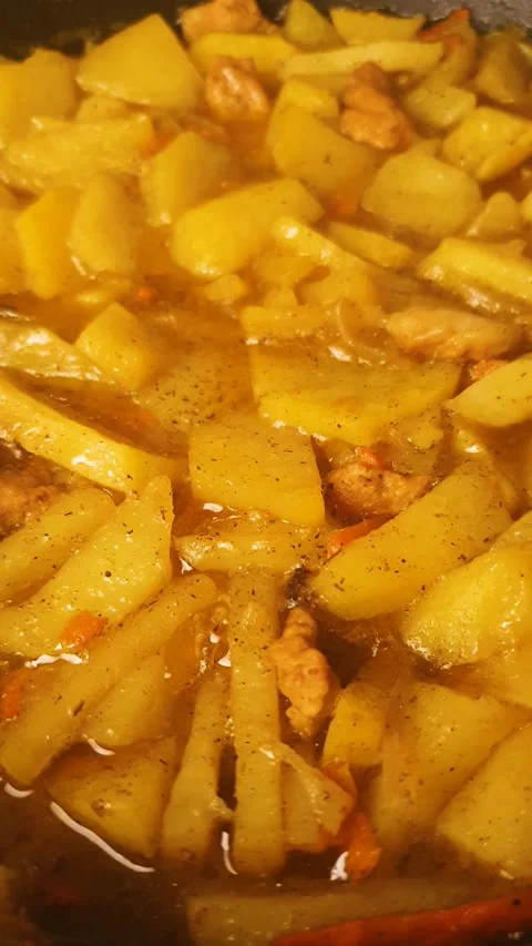 Braised Potatoes in Meat Broth Vertical Video. How to cook potatoes Stock Footage 345743107