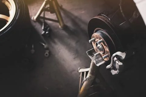 Brake disc system without wheel on a jack stand Stock Photos
