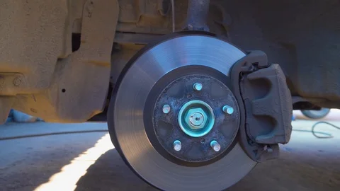 Brake disc view in a car auto service Stock Footage 107153412
