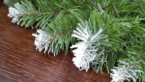 A branch of artificial spruce lies on the surface of the fireplace Stock Footage 120694172