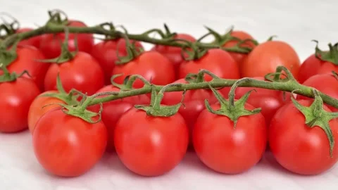 Branch of cherry tomatoes on the marble table texture Vídeos de archivo 272792019