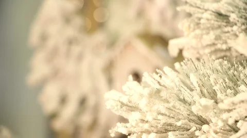 A branch from the Christmas tree, the focus moves to the birdhouse. Stock Footage 99148424