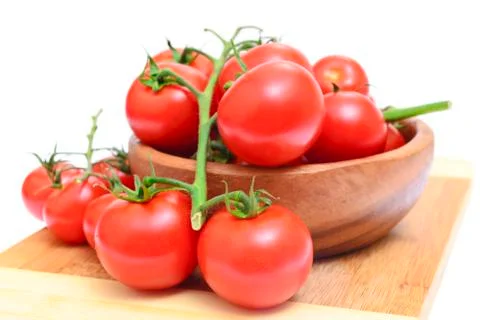 Branch of tomatoes isolated on white background Foto stock