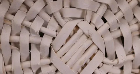 Branches painted white from which a decorative basket is woven, close up Stock Footage 311609296