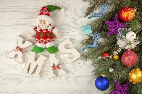 Branches of spruce on light background. Christmas toys, balls. Christmas Stock Photos