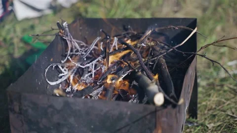 The branches of the tree burn in the grill to form coals for barbecue Stock Footage 204959812