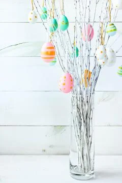The branches of the trees decorated with multi-colored Easter eggs Stock Photos