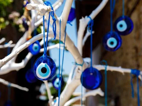 The branches of white old tree decorated with the eye-shaped amulets - Nazar Stock Photos