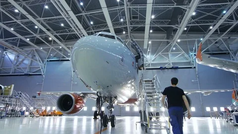  Brand New Airplane Standing in a Aircraft Maintenance Hangar  Stock Footage