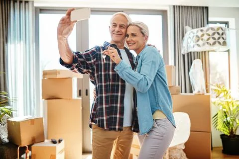 Brand new memories for a brand new home. a happy mature couple taking a selfie Stock Photos