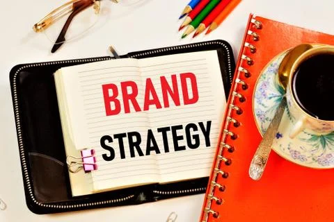Brand strategy - the text label in the notebook. Stock Photos