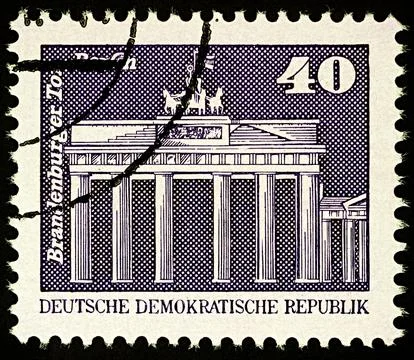 Brandenburg Gate in Berlin on postage stamp Stock Photos
