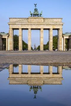 The Brandenburg Gate in Berlin reflected in a puddle Stock Photos