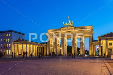 Brandenburg gate illuminated in Berlin, Germany Stock Photos