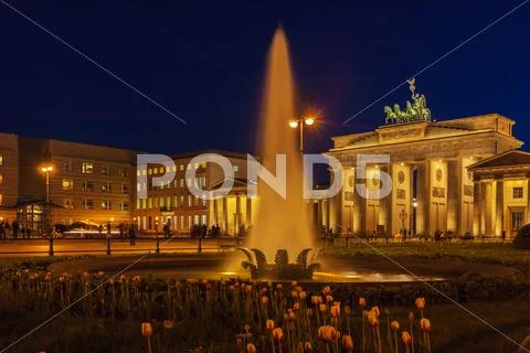 Brandenburg gate illuminated in Berlin, Germany Stock Photos