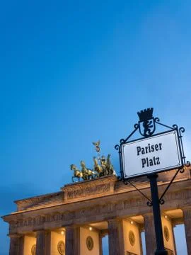 Brandenburg gate; left perspective in a cloudy sunset Stock Photos