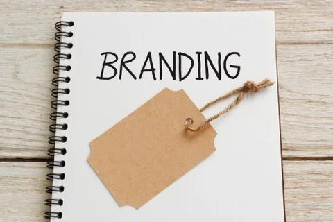 Branding concept with brand tag on notebook Stock Photos
