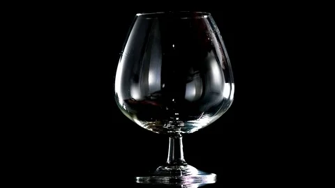 Brandy on a black background slow motion Stock Footage 92005277