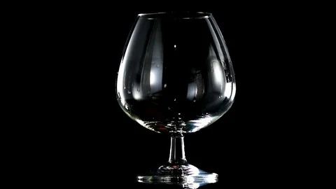 Brandy on a black background slow motion Stock Footage 92005278