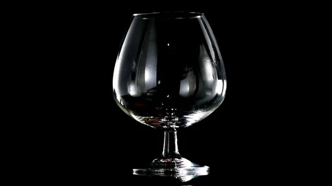 Brandy on a black background slow motion Video stock 92005312