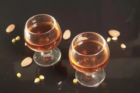 Brandy glasses on black background. Stock Photos