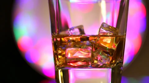 Brandy with ice turns around HD Stock Footage 34168965