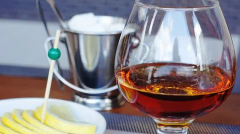 Brandy with lemon. Stock Photos